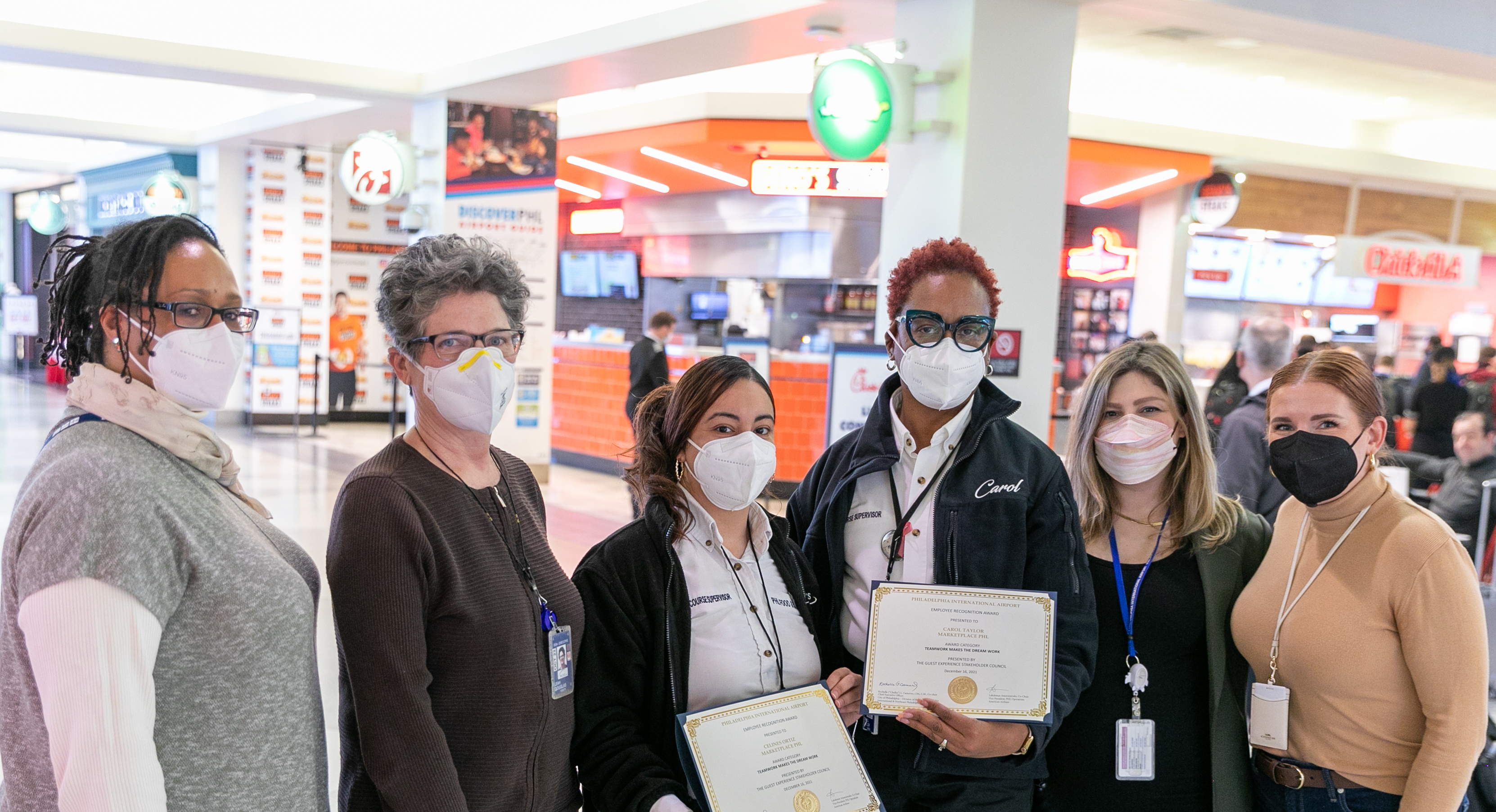 Carol and Celines with the airport's guests experience team