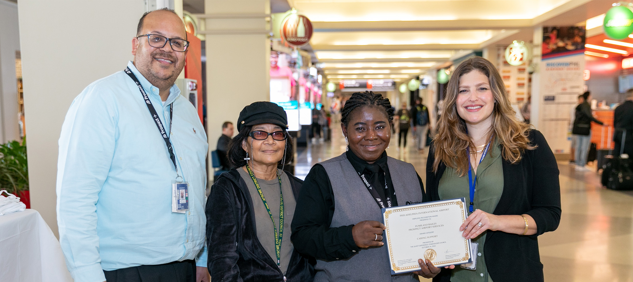 Fumilayo holding certificate