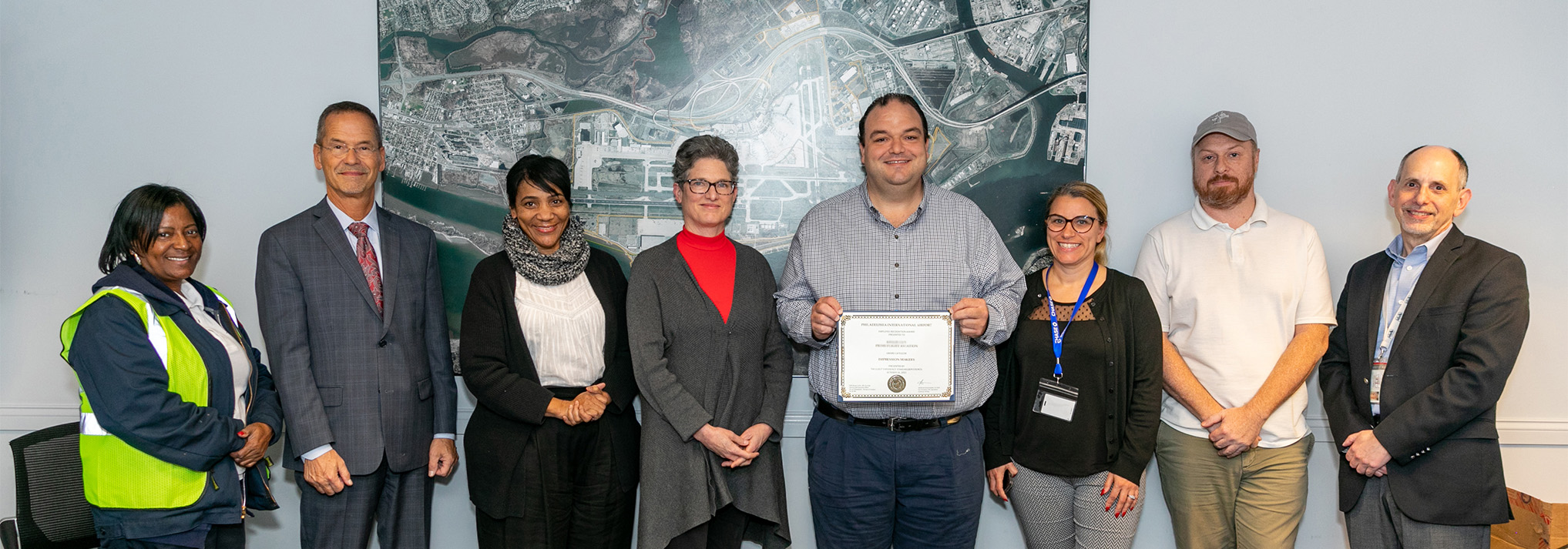 ben with team holding certificate