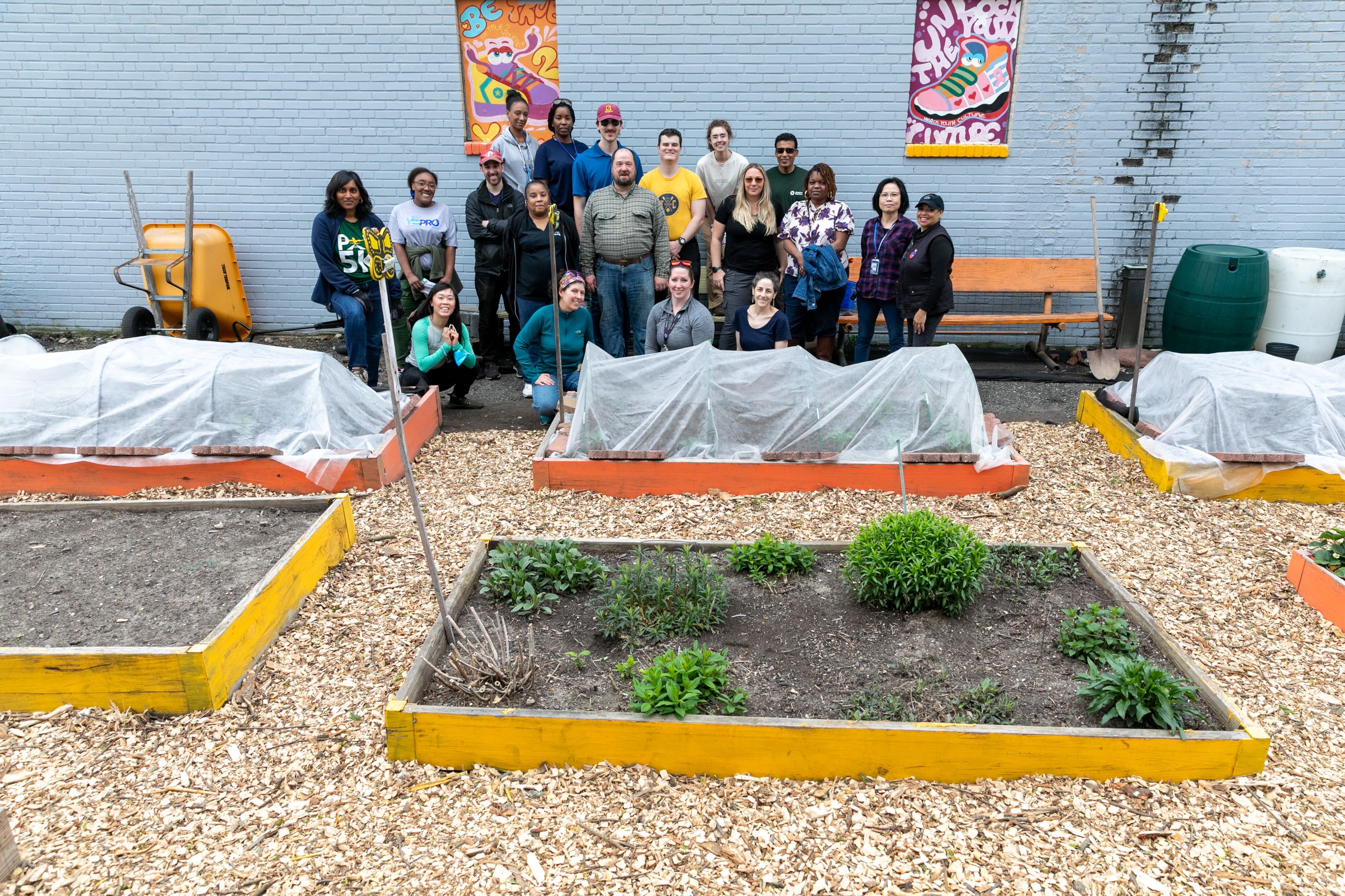 Staff members gathered in garden after clean-up.