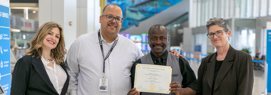 Ahmed holding award