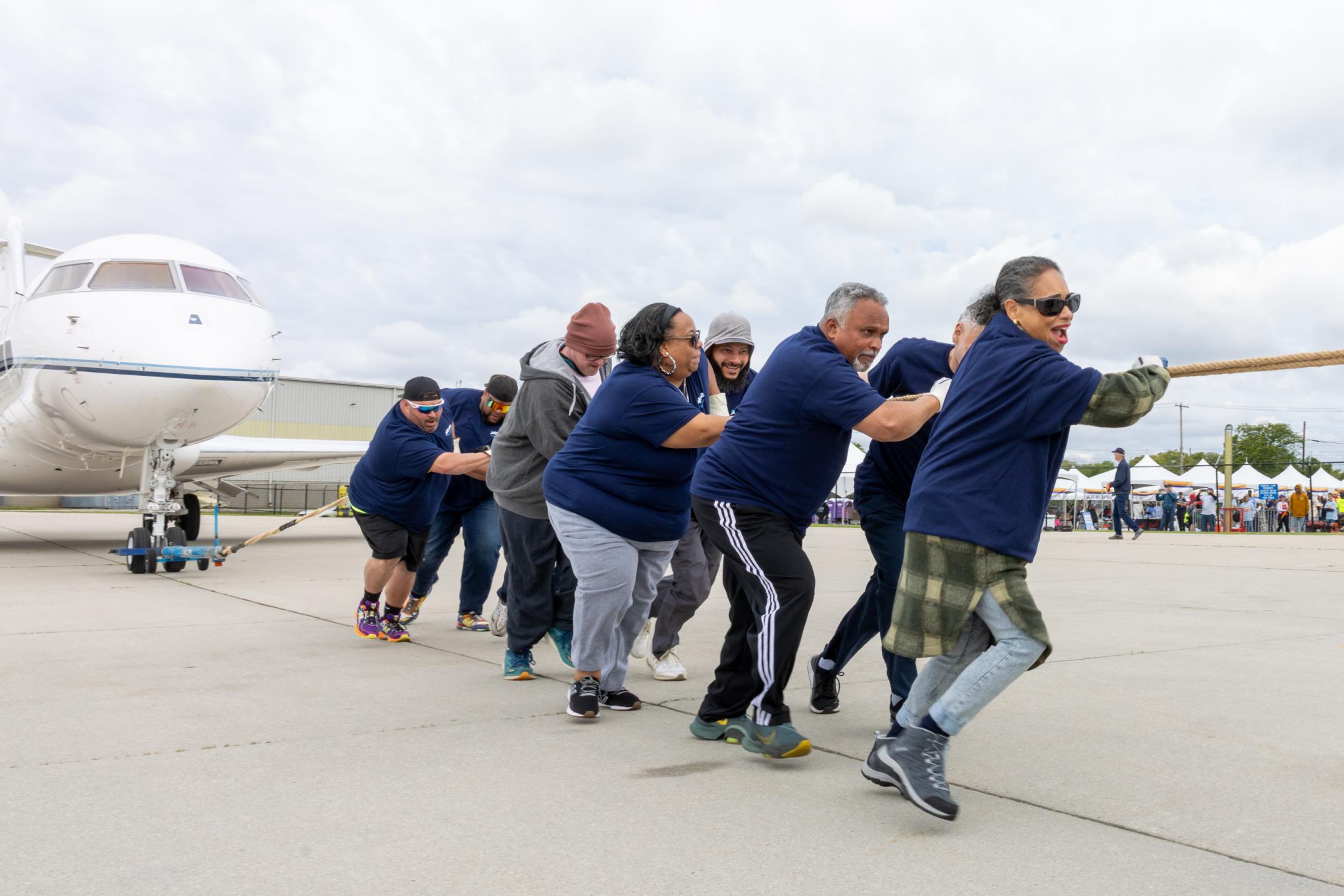 PHL Employees Pulling Plane 