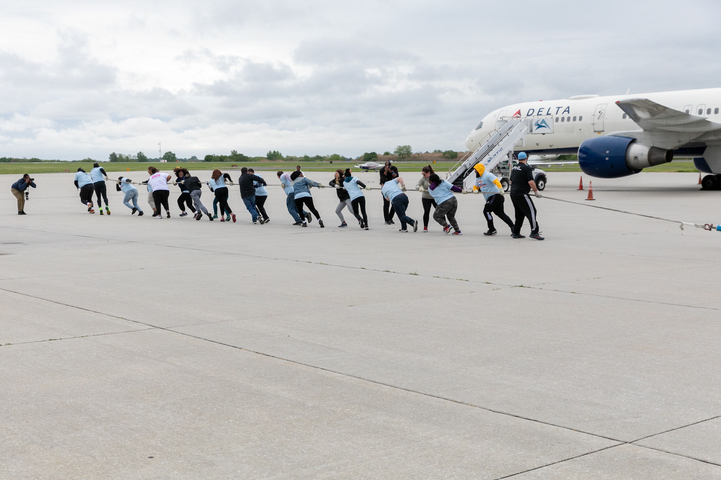 Team PHL pulling plane