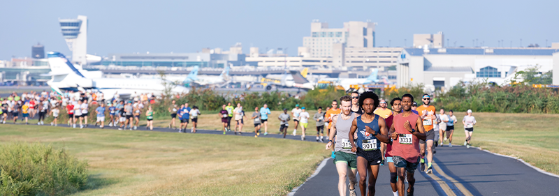 people running on PHL runway 