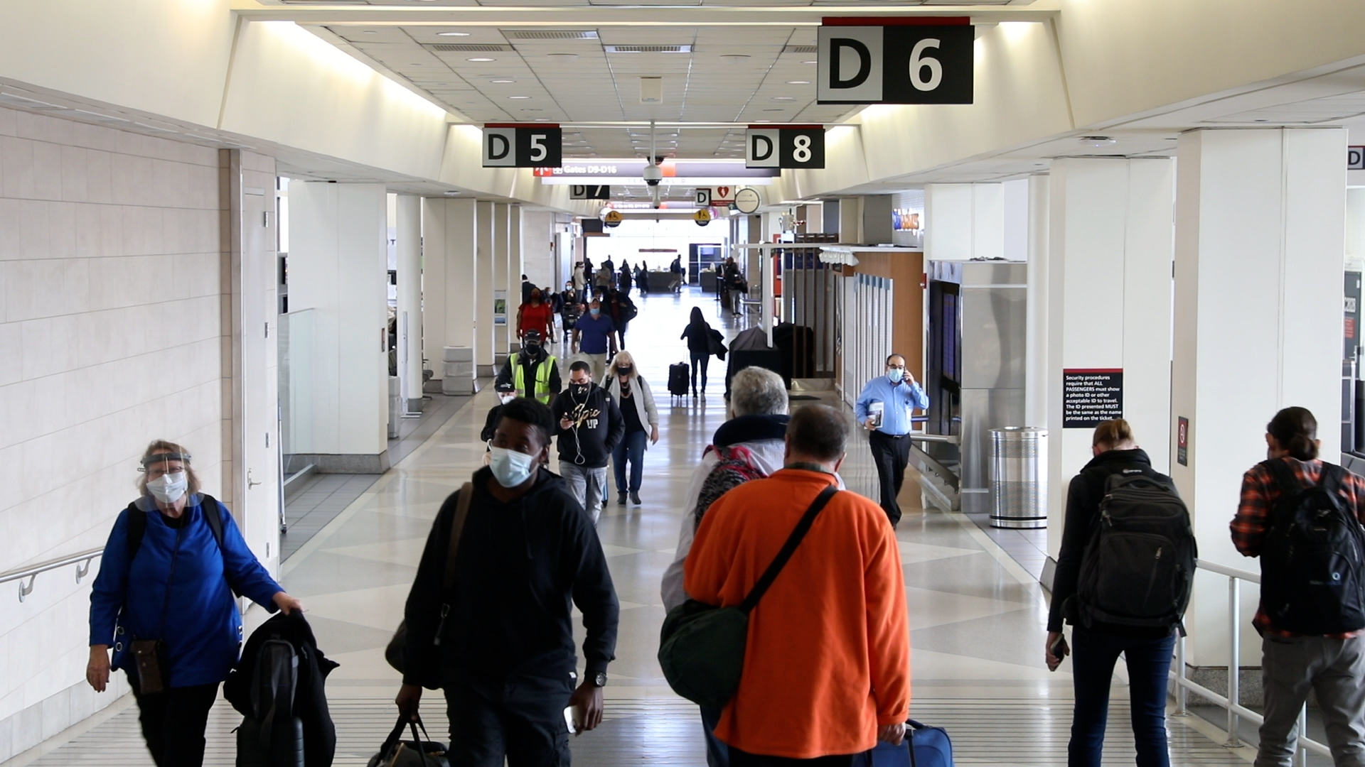 passengers with masks in terminal