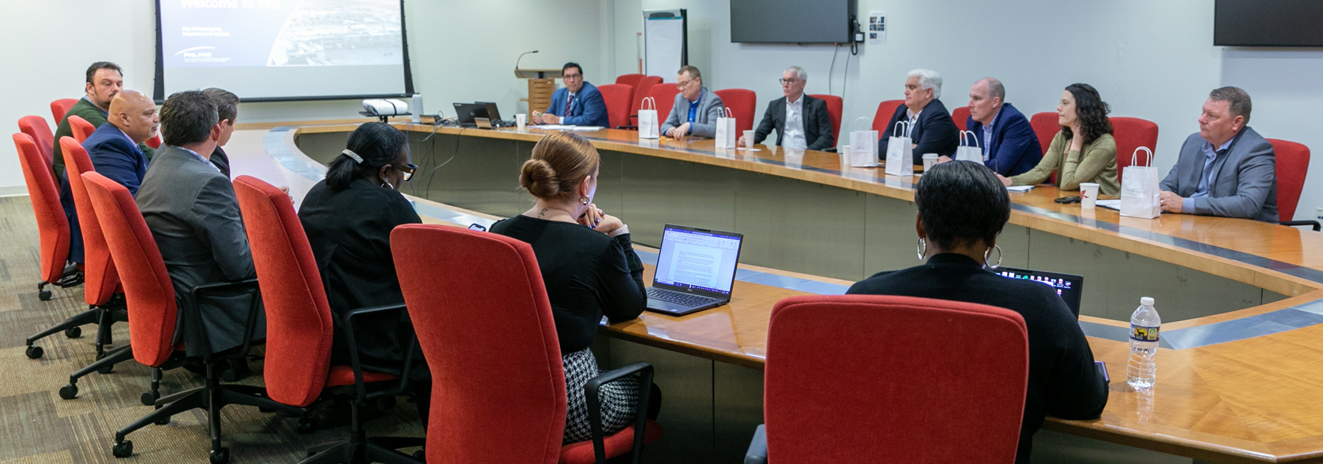 Meeting at large table in conference room