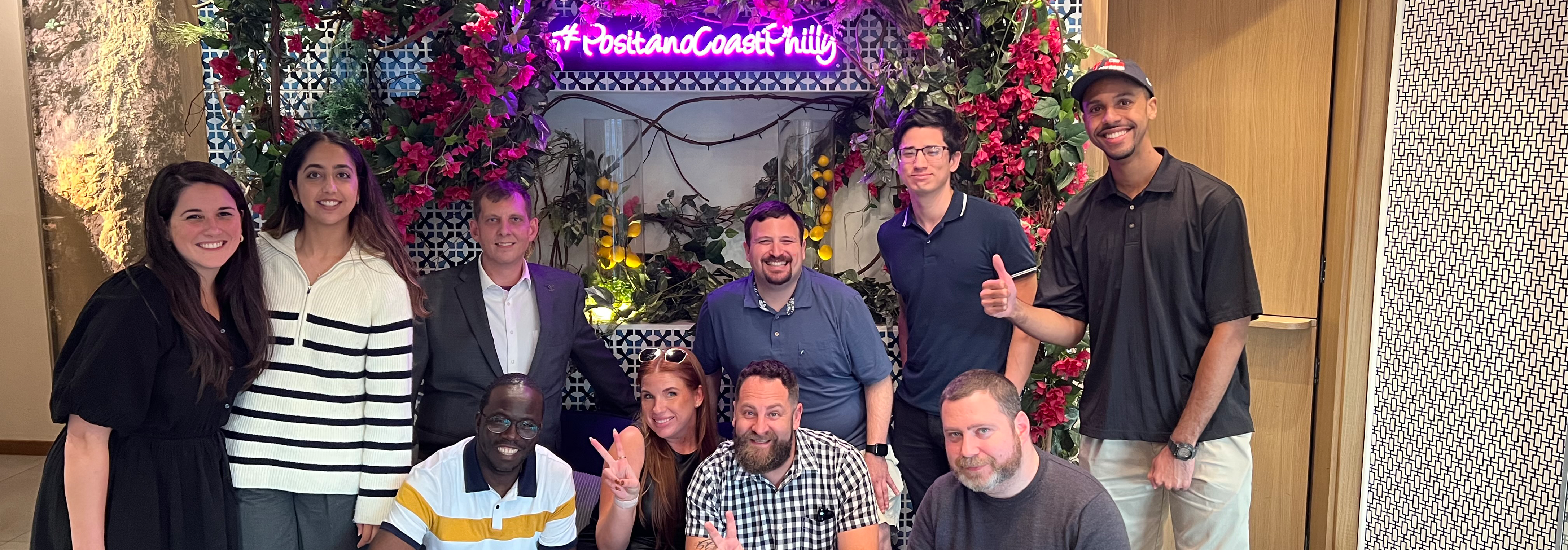 group photo in front of Positano coast Philly sign