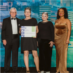 Leah and heather accepting award