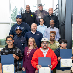 bridge program graduates holding certificates