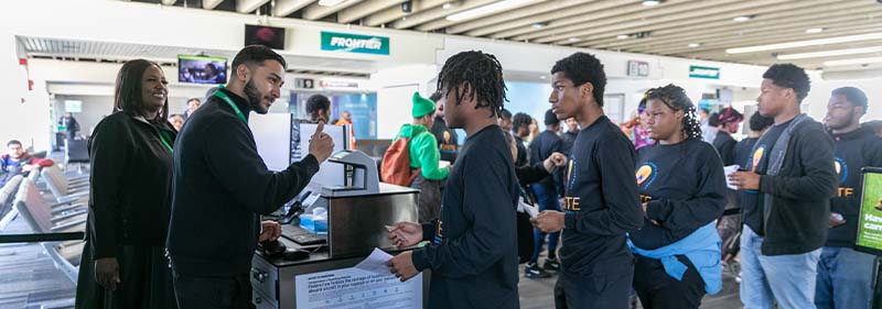 students boarding plane