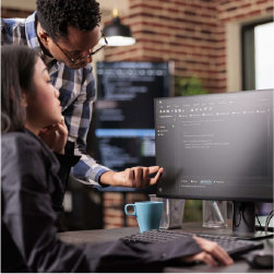Person from IT helping someone with computer