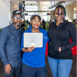 Jeanine holding award