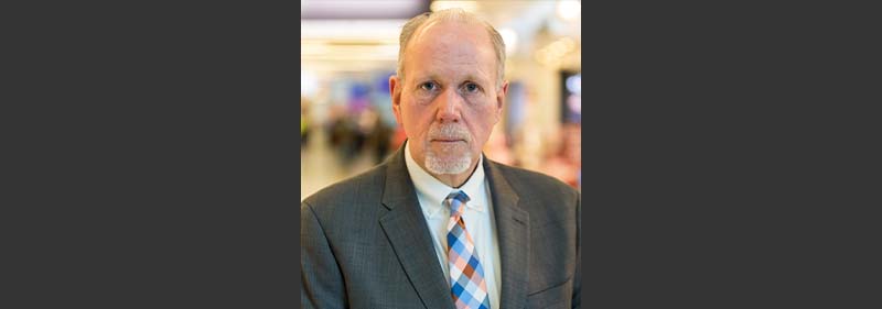 Keith Brune headshot with black background
