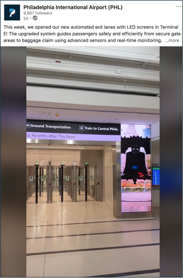 Exit lanes in terminal E with video playing on the sides of the lane