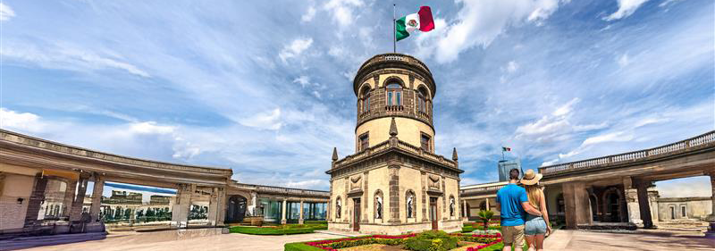 tower in plaza with tourists next to it