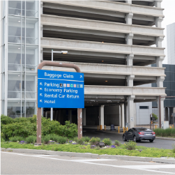 parking garage with blue directional sign