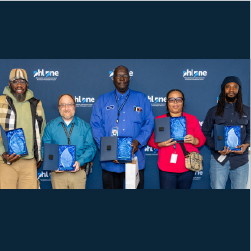 PRIDE Winners holding awards