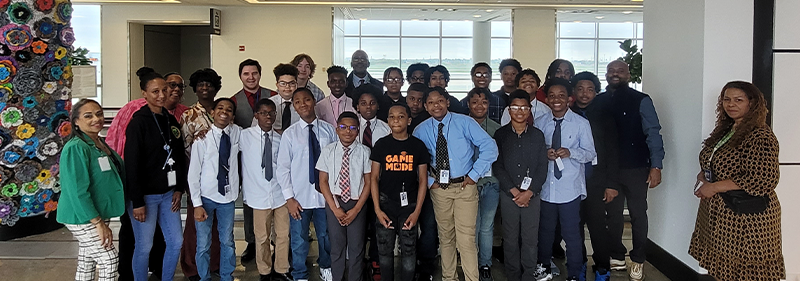 a group of students on a tour at the airport