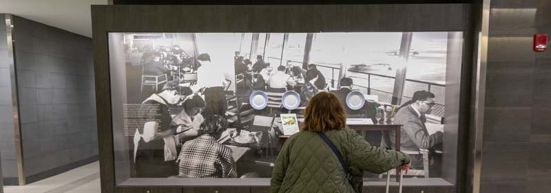 passenger looking at exhibit