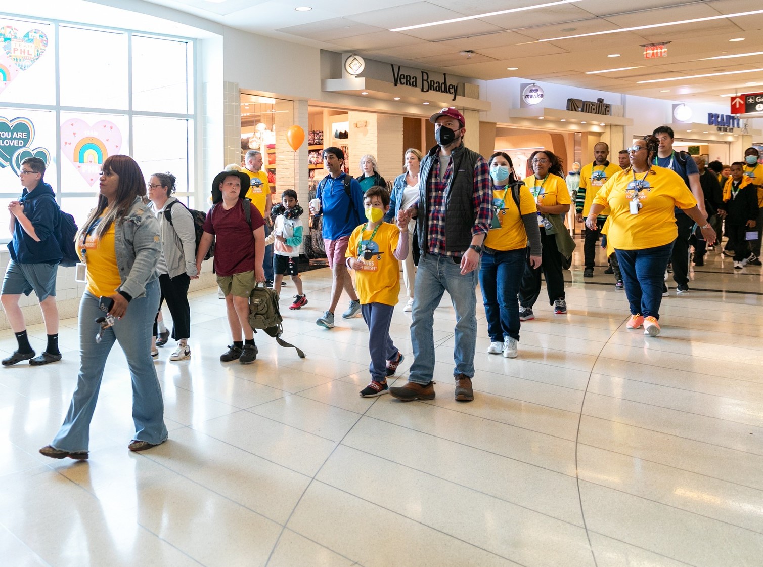 People walking in airport terminal