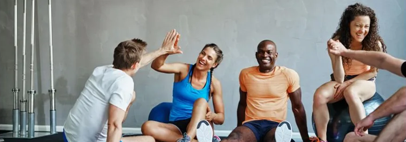 group of 4 people in a gym